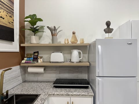 Fridge, microwave, stovetop, coffee/tea maker