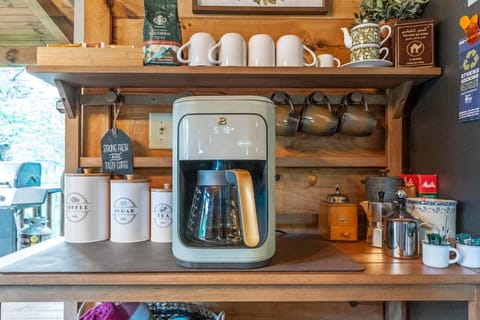 Coffee bar has decaf & regular coffee, creamer, tea, sugar & sugar substitute