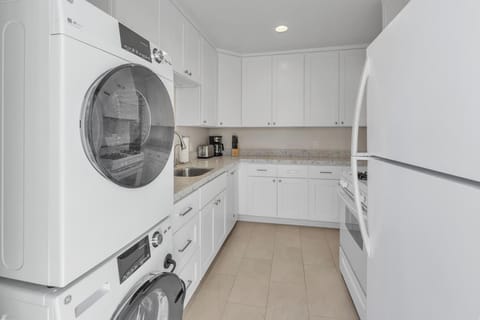 Kitchen: fully stocked with washer and dryer