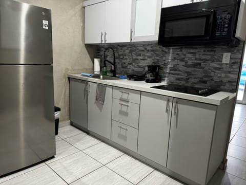 Fridge, microwave, stovetop, coffee/tea maker