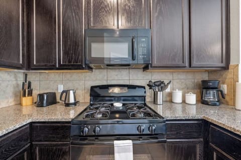 Let our built-in microwave and gas range aid in preparing your meals.