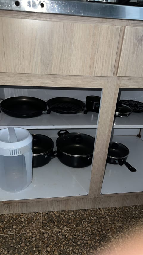 Fridge, coffee/tea maker, electric kettle, cookware/dishes/utensils