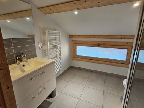 A spacious and updated full bathroom.