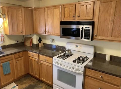 Full kitchen w/newer granite countertops, stove, oven, microwave & coffee-maker