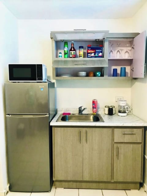 Fridge, microwave, stovetop, coffee/tea maker