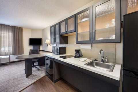 Cook easy meals with full-size sink, stovetop, and prep space.