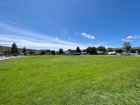 Nestled beside Brooklyn elementary school with a large field