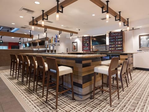 Gather for craft drinks around the sleek, social bar island.