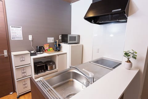 Fridge, microwave, cookware/dishes/utensils