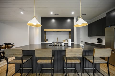 Kitchen: Sleek design and modern finishes for culinary creativity and gathering fun!