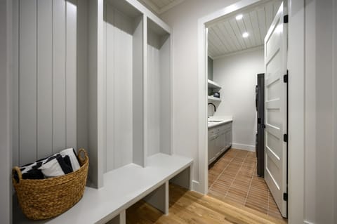 Mudroom: Stylish storage for your gear, with sleek cabinets and a charming basket waiting!