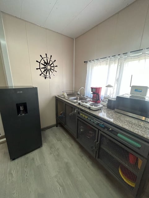 Fridge, microwave, coffee/tea maker, toaster