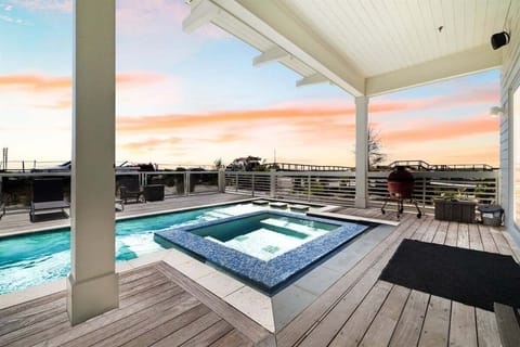 After a day at the beach, enjoy the sunset from your private pool and spa.