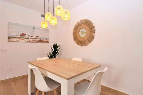 Another view of the modern dining area for four guests