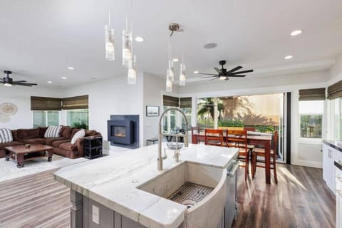 Imagine cooking in this fully remodeled Gourmet Chef's Delight Kitchen. Triple stack professional grade Thermador ovens, 6 burner stove, pot filler, and large island with extra large industrial style Farmhouse sink. Perfect for the family cook, and