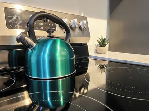 Start your mornings right with our complimentary selection of coffee and There's a coffee maker and a kettle available for your use. We've stocked the kitchen with a comprehensive set of cookware, including pots, pans, baking trays, and various cooking utensils. You'll find everything you need to whip up a feast.