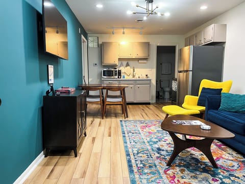 Step into a cozy and stylish space designed to make you feel right at home during your stay. Sink into our plush and luxurious sofa and chairs, thoughtfully arranged to provide ample seating for all guests. Whether you want to relax with a book, watch your favorite shows on the flat-screen TV, or simply engage in pleasant conversations with your travel companions, this living ...