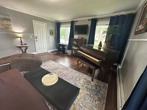 Enjoy the comfortable living room with the baby grand!
