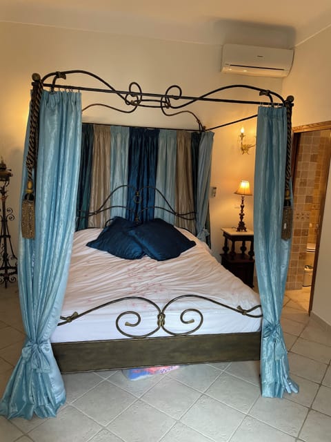 Downstairs 'blue bedroom' with king sized bed and ensuite bath/shower room