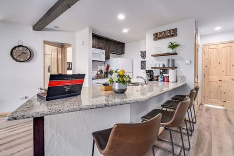 Breakfast bar seating with rustic leather stools.
