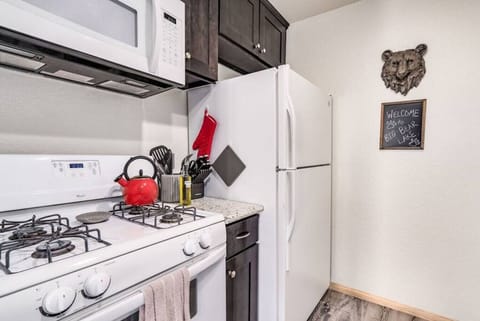 A nice modern open concept kitchen welcomes you to Big Bear Lake. The Kitchen is fully stocked with everything you need even a cute red teapot to brew yourself a nice cup of luxury tea.