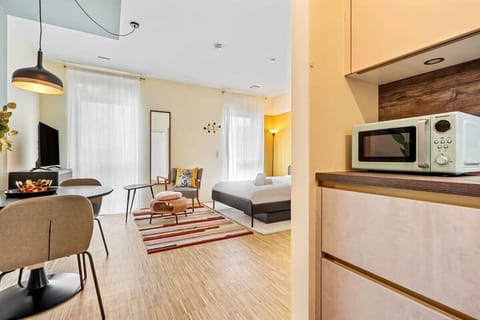 Fully-equipped studio blending sleep, eat, and live areas in harmony.