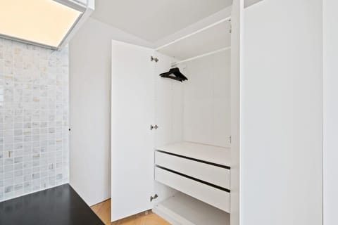 Keep your travel wardrobe chic and organized in our spacious closet.