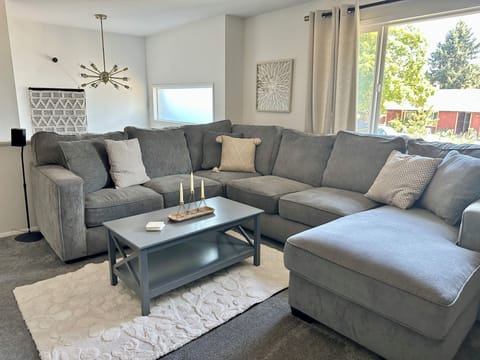 Comfortable and inviting living room with huge cozy couch.