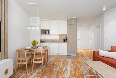 Fully equipped kitchenette with a dining area and living room