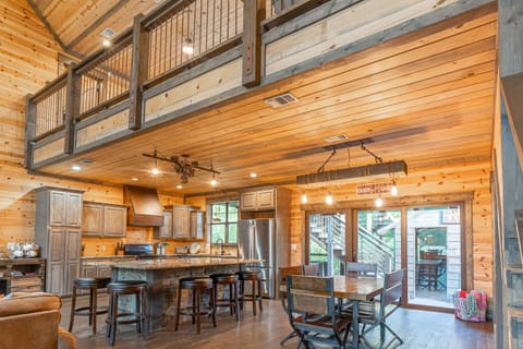 The beautiful luxury kitchen remains connected to all that's happening in the grand room keeping snacks accessible and everyone apart of the memories.