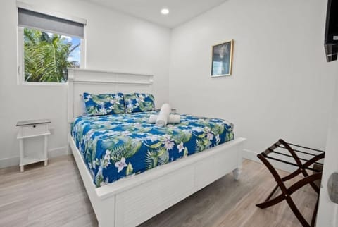 Upstairs bedroom with TV and queen size bed