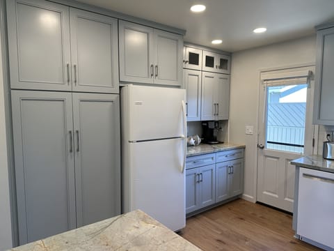 Large pantry next to refrigerator. Walk out balcony to back