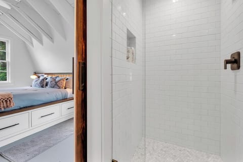 Upstairs level: king bed, sofa, ensuite bathroom