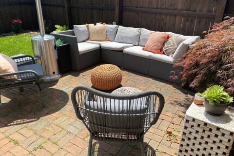 Private, fenced in backyard with heater, grills and seating