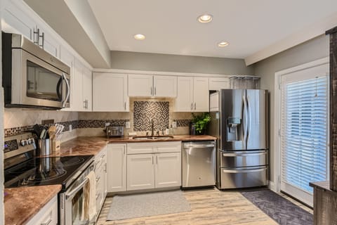 The fully equipped kitchen with stainless steel appliances.