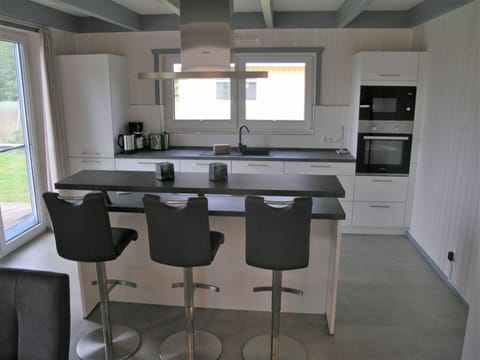 Oven, dishwasher, highchair, dining tables