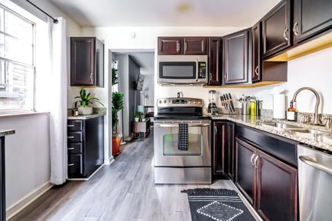 Our kitchen includes everything from pots and pans to a Frigidaire stainless steel oven—perfect for home-cooked meals