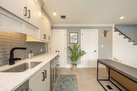 Sink, coffee maker, 4 refrigerator/freezer drawers, and a wine cooler