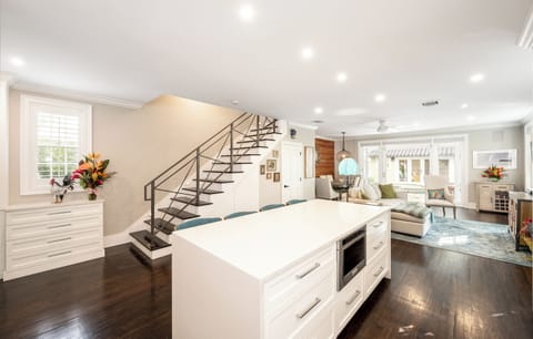 A lit staircase to the second floor and a ton of natural light