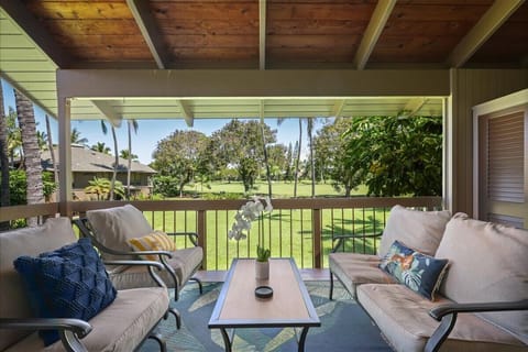 Covered lanai with beautiful views of tropical landscaping