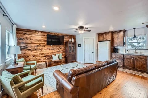 Open-concept living room with seamless flow to the kitchen and dining areas