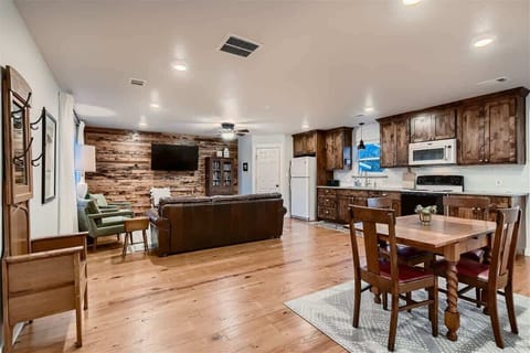 Enjoy an open-concept layout where the kitchen, dining, and living spaces flow seamlessly. Perfect for families and groups