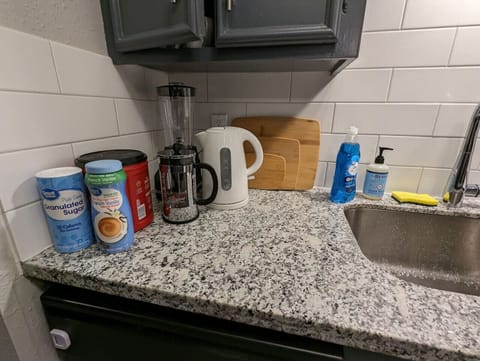 Fridge, coffee/tea maker, cookware/dishes/utensils