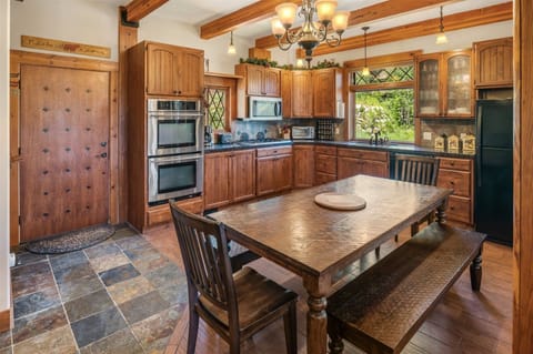 Open kitchen layout with dining room table.