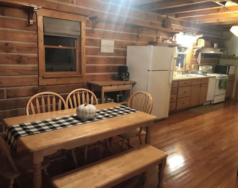 Kitchen has cooking and serving items, dishwasher, stove, microwave and disposer