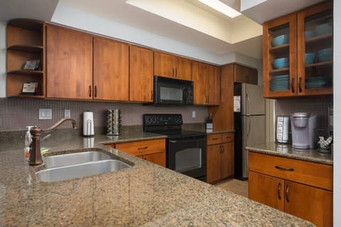 Fully stocked kitchen with granite countertops