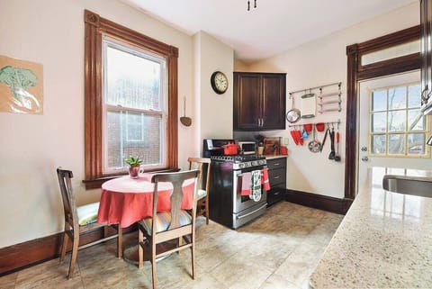 Reliable and well maintained kitchen with table for three.