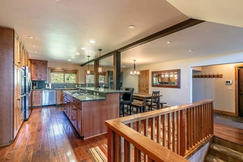 The open and social kitchen and dining area greet you when you enter the home.