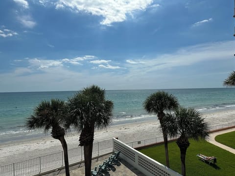 On the beach, sun loungers, beach towels