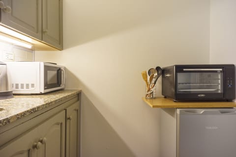 Fridge, microwave, electric kettle, cookware/dishes/utensils